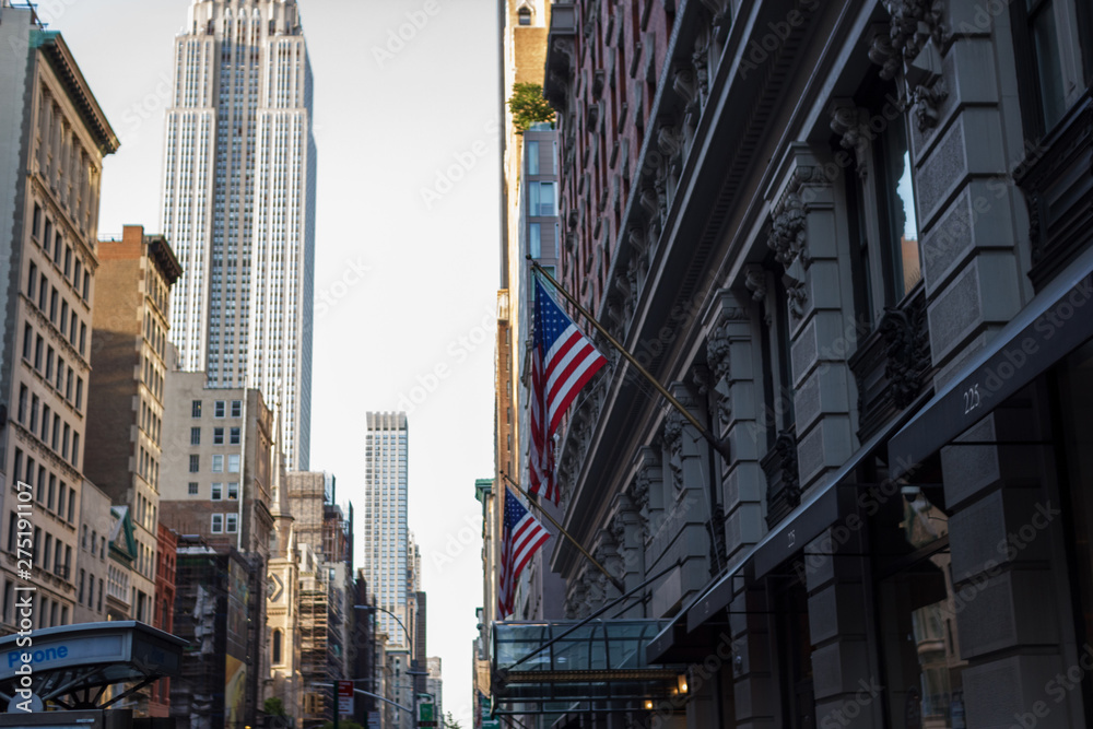 Obraz premium New York, NY / USA - May/27/2019: Skyscrapers of New York against the sky. The architecture of New York. Summer day in city