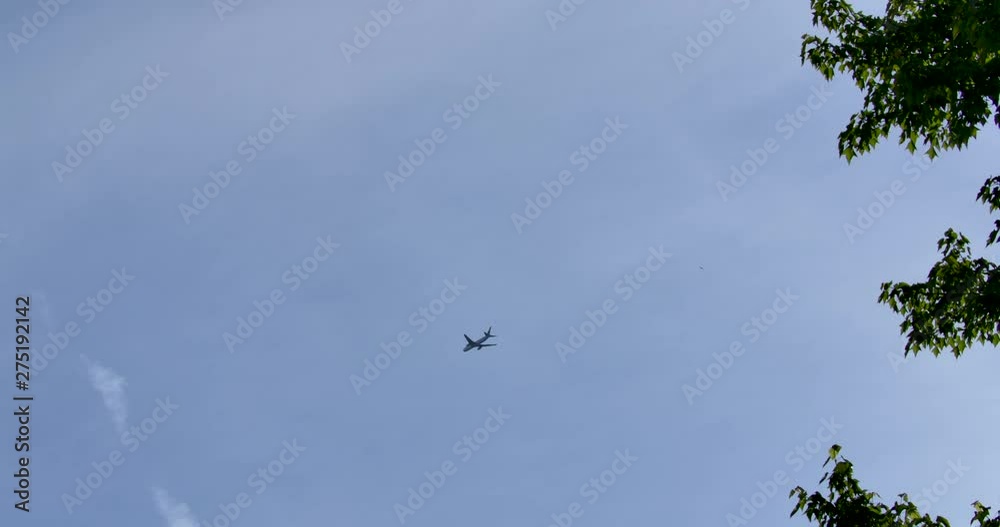 Airplane tracks across a blue sky Airplane tracks across a blue sky