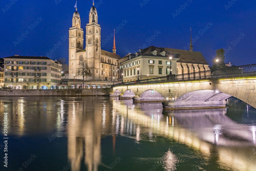View of Grossmunster and Zurich old town from Limmat river. The Grossmunster is a Romanesque-style Protestant church in Zurich, Switzerland.