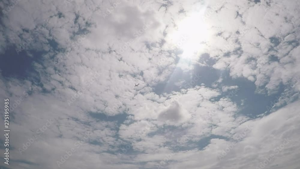 A plane flying overhead on a bright sunny day. A plane flying overhead on a bright sunny day.