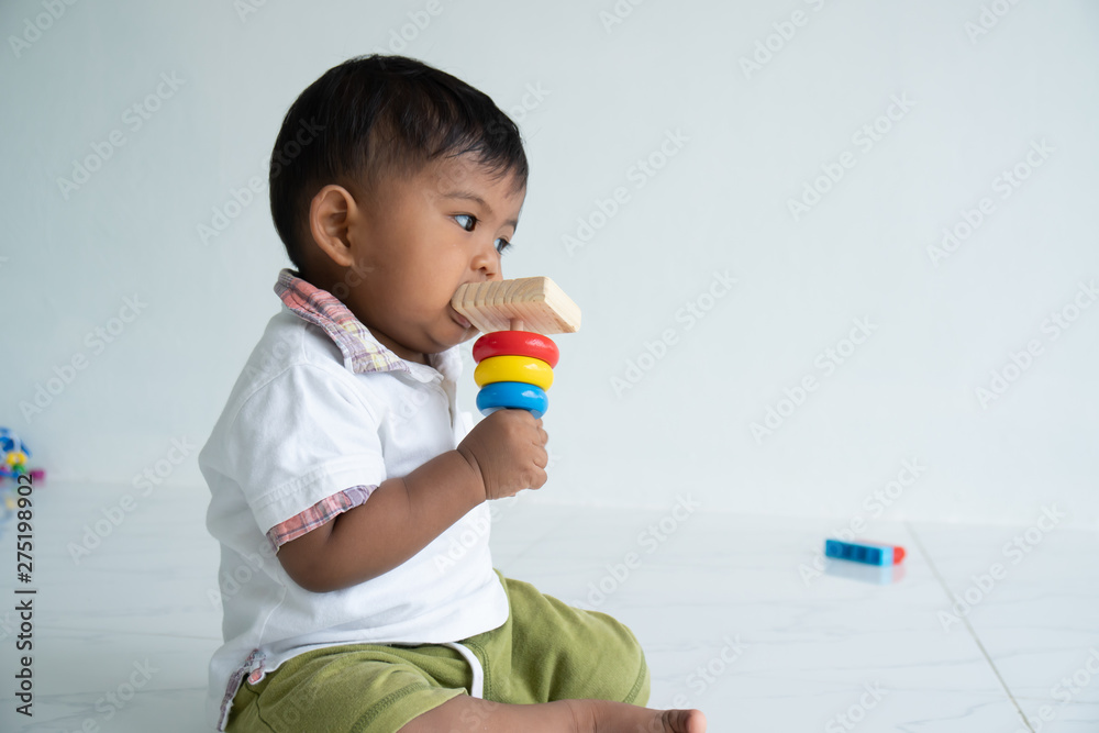 little baby boy play wooden toy at room little baby boy play wooden toy at room