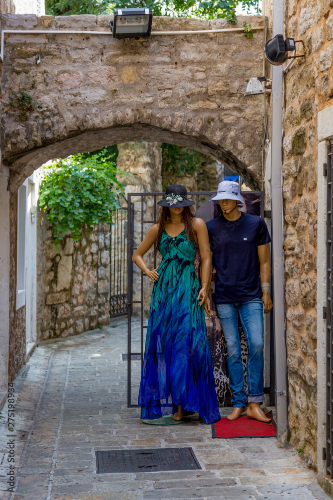 Mannequins on a narrow street in the city of Budva in Montenegro