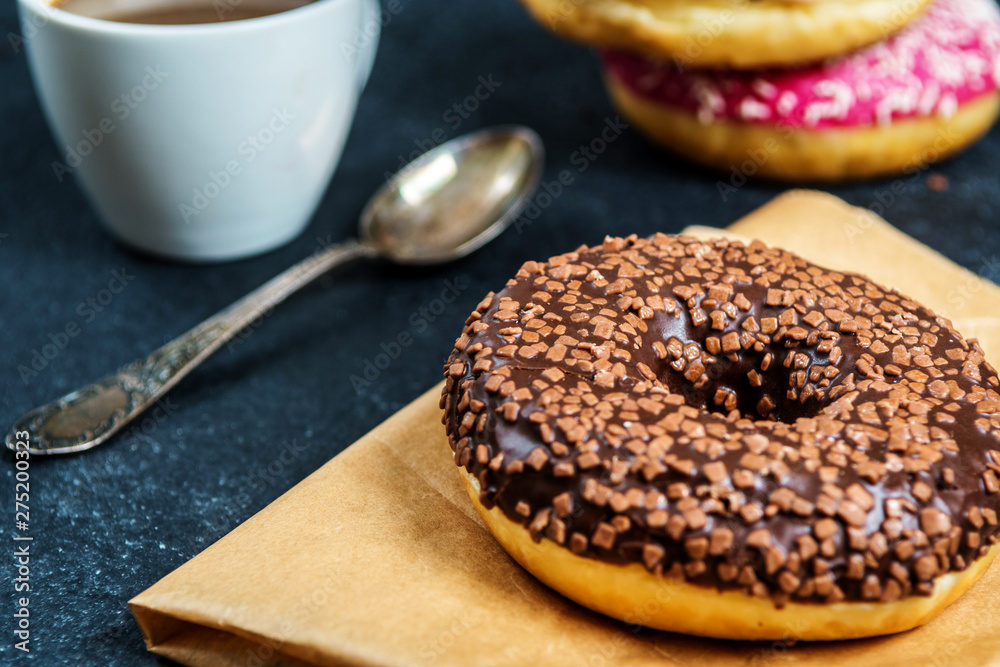 Sweet donuts on black stone table Sweet donuts on black stone table