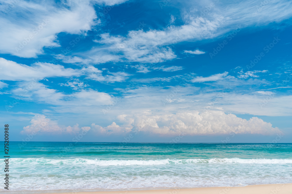 Beautiful tropical beach with blue sky and white clouds abstract texture background. Copy space of summer vacation and holiday business travel concept.