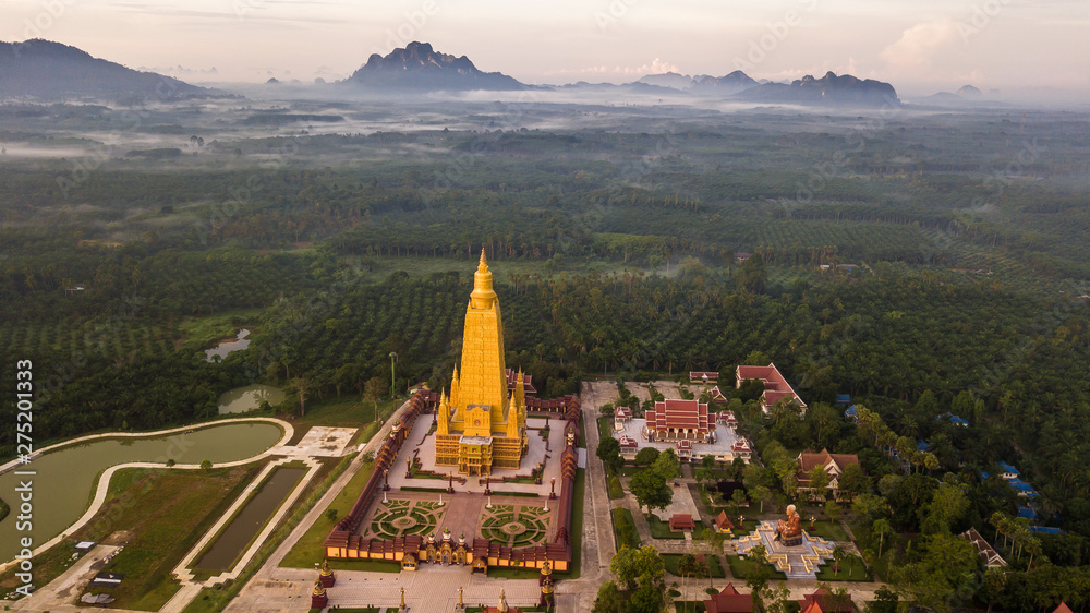 Aerial photo  of Beautiful temples in the morning atmosphere , Thailand .