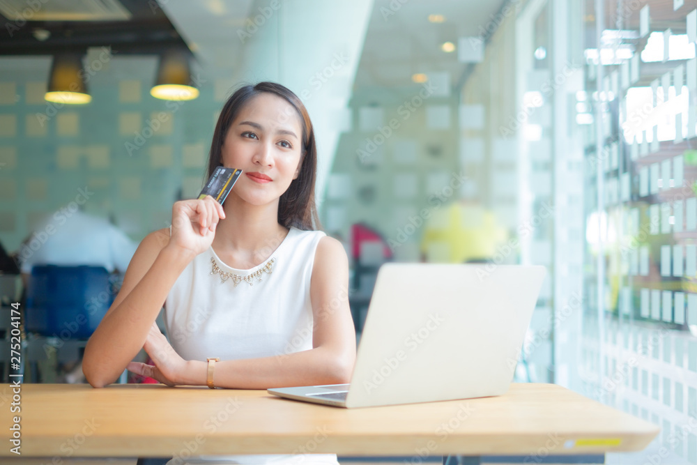 beautiful woman holding credit card using laptop enjoy shopping website online, shopping concept.