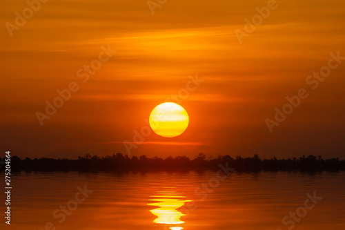 Fototapeta Naklejka Na Ścianę i Meble -  Sunset sky at the lake in golden hour.