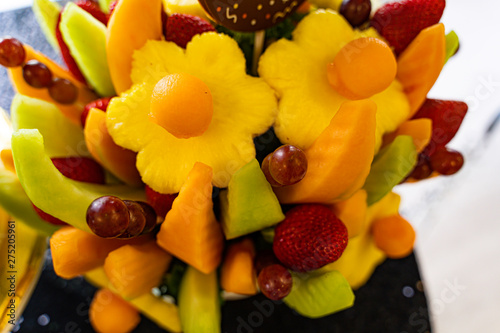 Edible Fruit basket arrangement with a variety of fruits photo