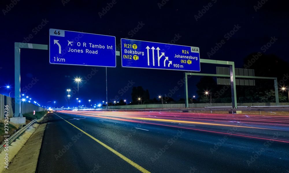 Fototapeta premium Motorway Signs on Highway at night