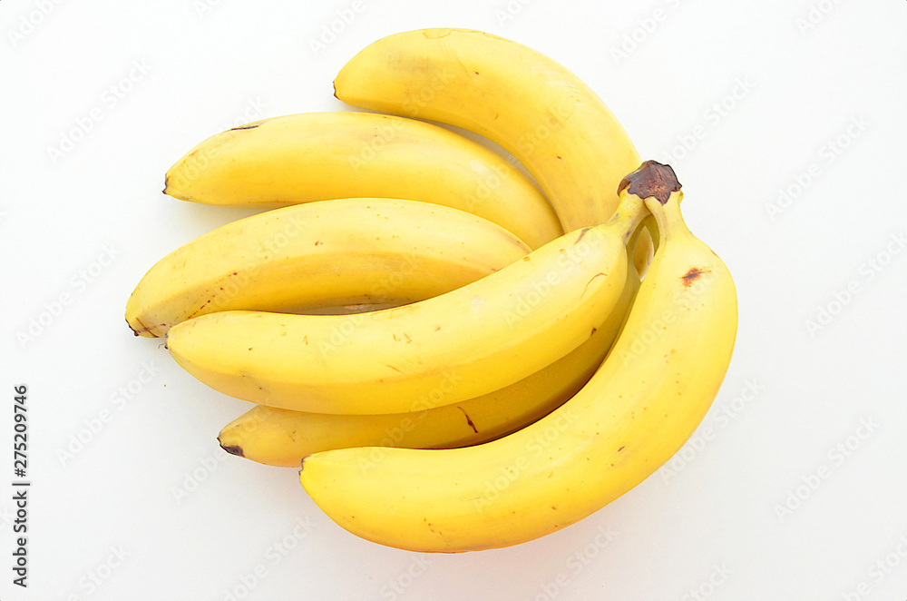 Yellow ripe bananas on white background