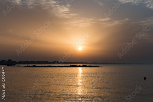 A Small Island Visible at Sunset near the Darsena Beach in Rimini, Italy © LiviuConstantin