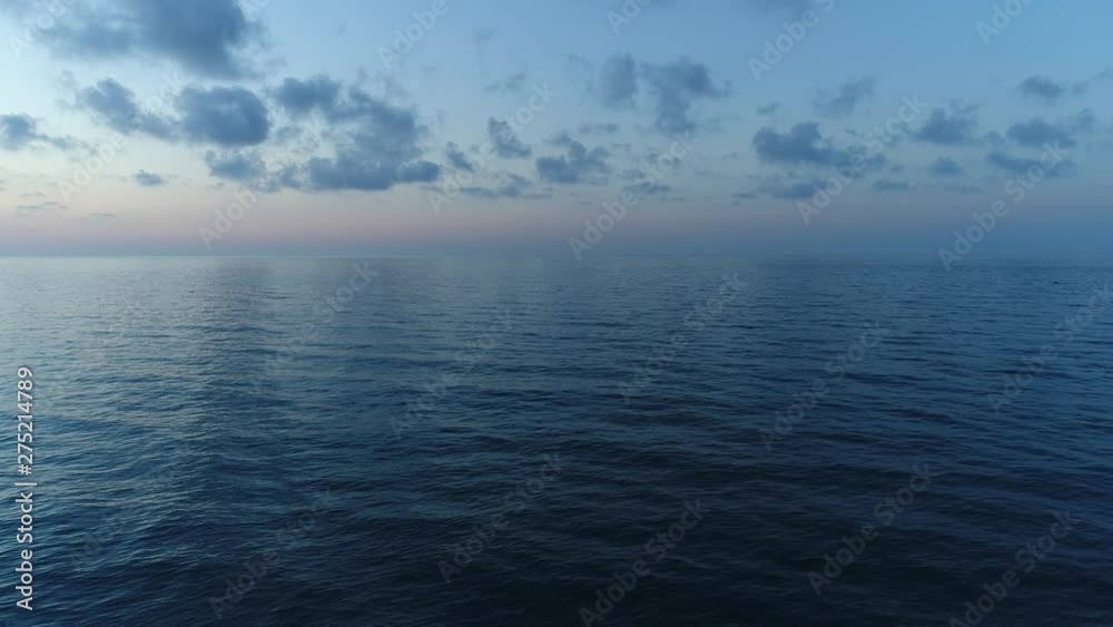 Dark calm sea and sky in the evening. Beautiful sea background, aerial view.