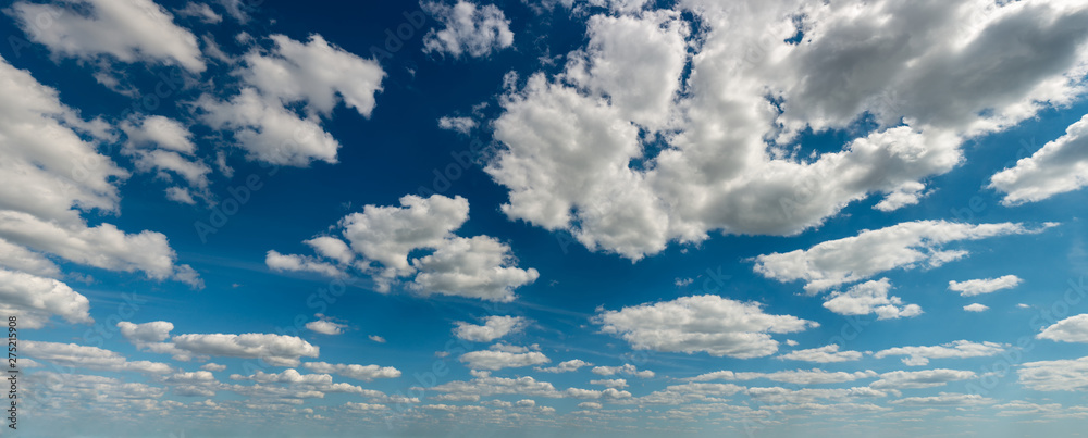 Fantastic soft white clouds against blue sky, natural composition - panorama