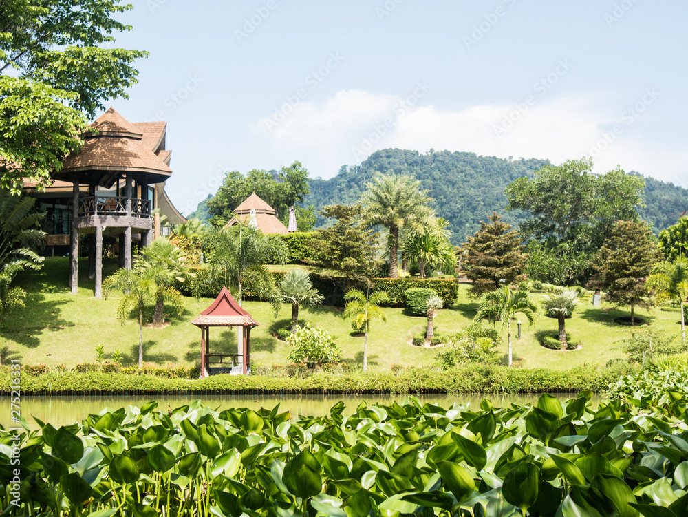 Fishing resort Asia, Buddhist temple at garden next to the lake in Krabi, Thailand Fishing resort Asia, Buddhist temple at garden next to the lake in Krabi, Thailand