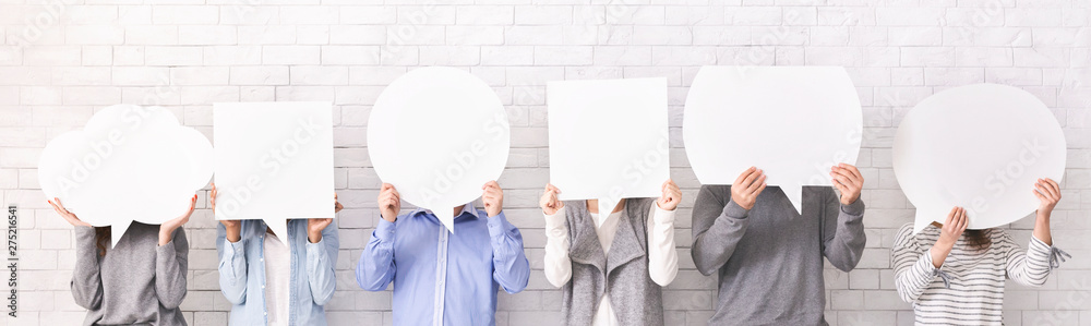 People holding empty speech bubbles at their faces - obrazy, fototapety, plakaty 