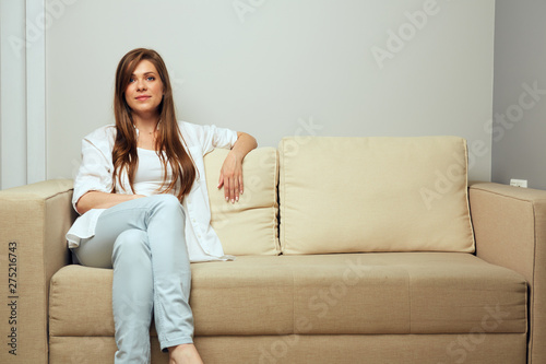  woman resting at home on sofa.