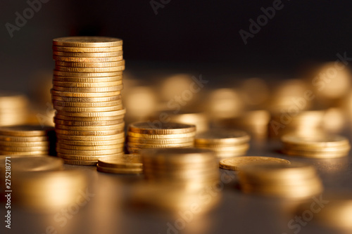 Stack of Gold Coin on Black Background. photo