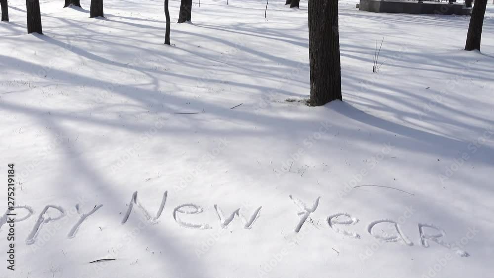 Inscription of happy new year on snow. Shooting in the winter. Inscription of happy new year on snow. Shooting in the winter.