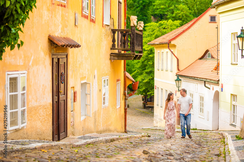 Young couple walking in old town of Prague