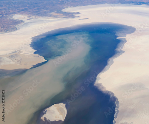 Fototapeta Naklejka Na Ścianę i Meble -  Beautiful aerial view of Lake Eyre, officially known as Kati Thanda - Lake Eyre, an endorheic lake in the outback of South Australia, including Stuarts Creek and Silcrete Island