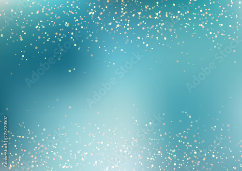 Abstract falling golden glitter lights texture on blue turquoise background with lighting. Magic gold dust and glare. Festive Christmas background.