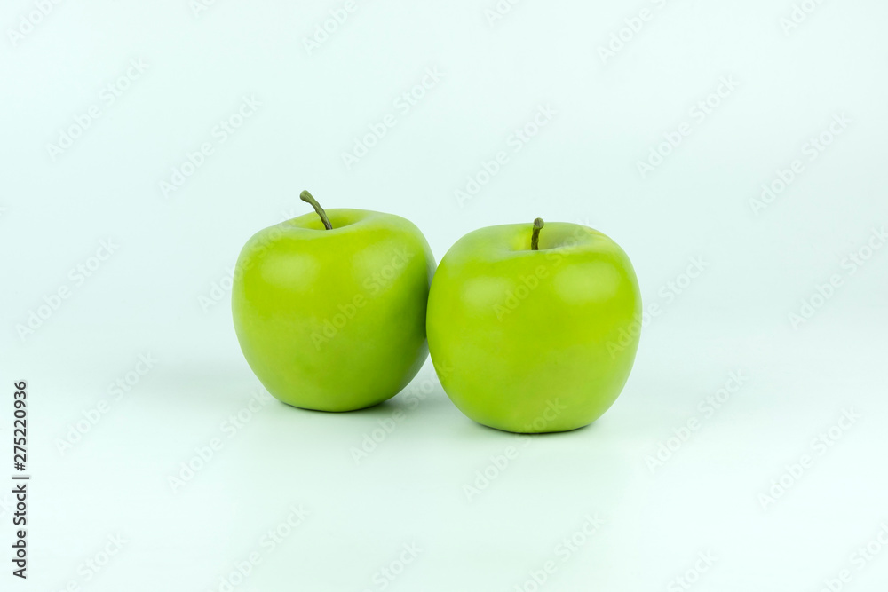 Double fresh green apples isolated on white background with clipping path. Double fresh green apples isolated on white background with clipping path.