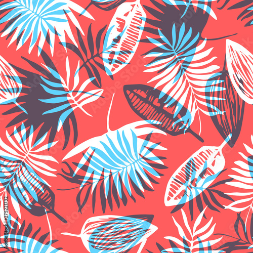 Fashion seamless pattern with overlap mess of bright blue and white tropical leaves on red background. Trendy exotic plants texture for textile, wrapping paper, surface, wallpaper, background