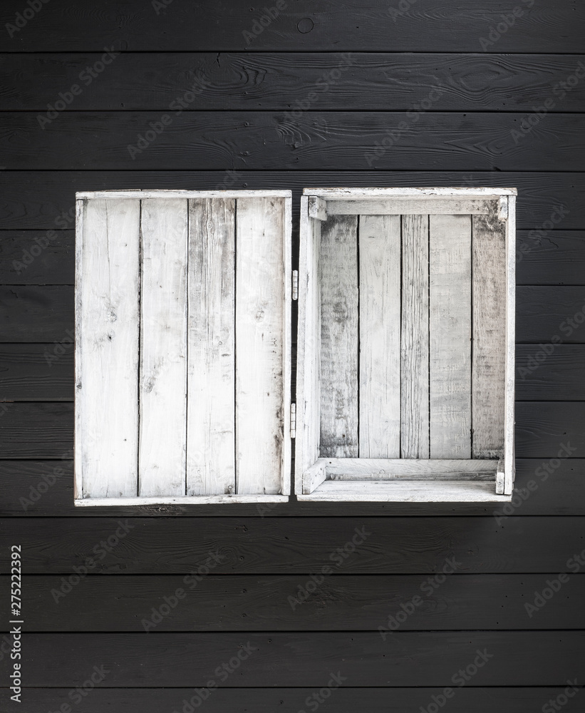 old white empty wooden box isolated on black wooden background old white empty wooden box isolated on black wooden background