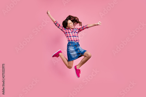 Full length body size view photo delighted funny lady people young person raise hands fists scream yeah achievement content isolated wear fashionable plaid denim jeans skirt outfit pastel background