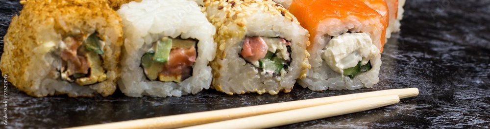 Banner of Set of sushi and maki on stone table. copy space Banner of Set of sushi and maki on stone table. copy space