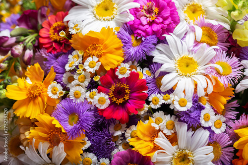 Photo bouquet of various summer flowers as background