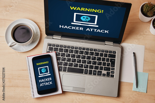 Hacker attack concept on laptop and smartphone screen