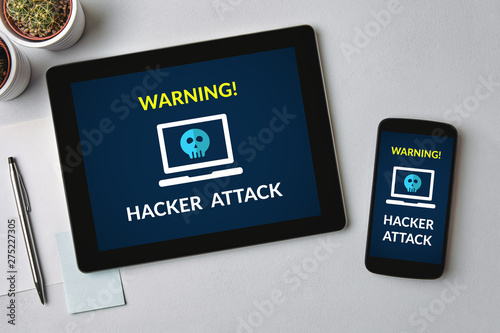 Hacker attack concept on tablet and smartphone screen