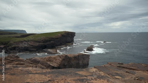 Waves splasing at the cliffs of orkney island. photo