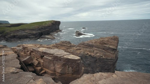 Waves splasing at the cliffs of orkney island. photo