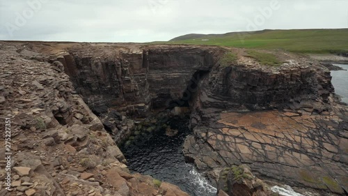 Waves splasing at the cliffs of orkney island. photo