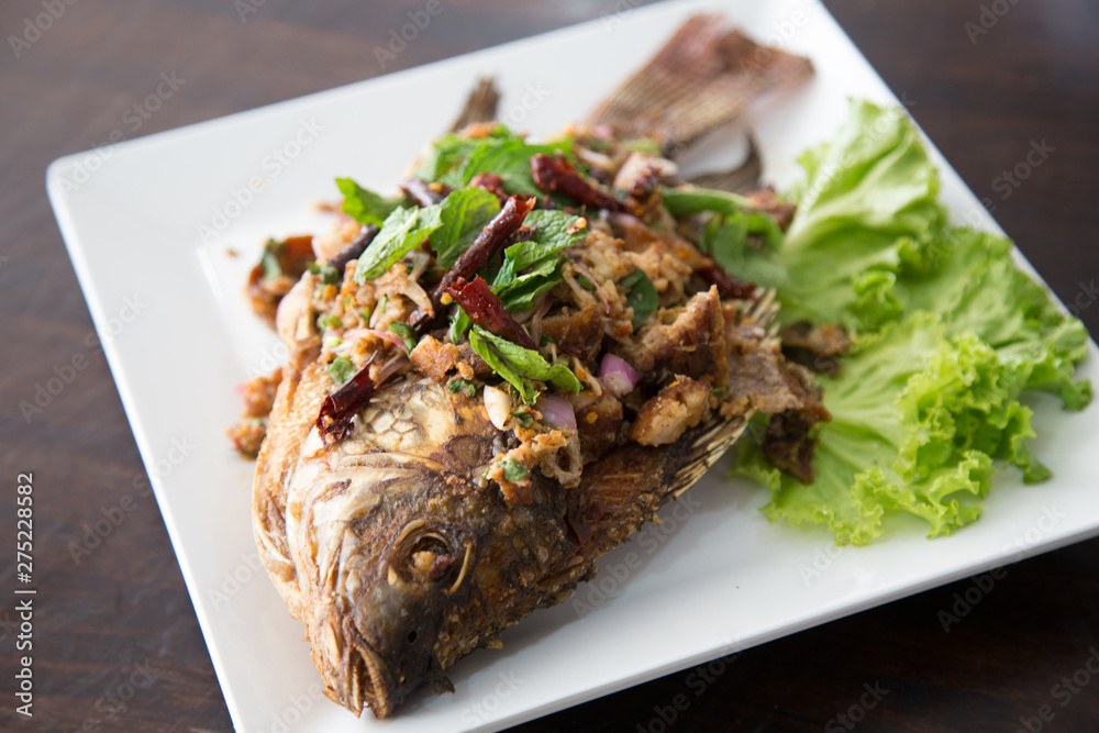 Fried fish with fresh thai herbs