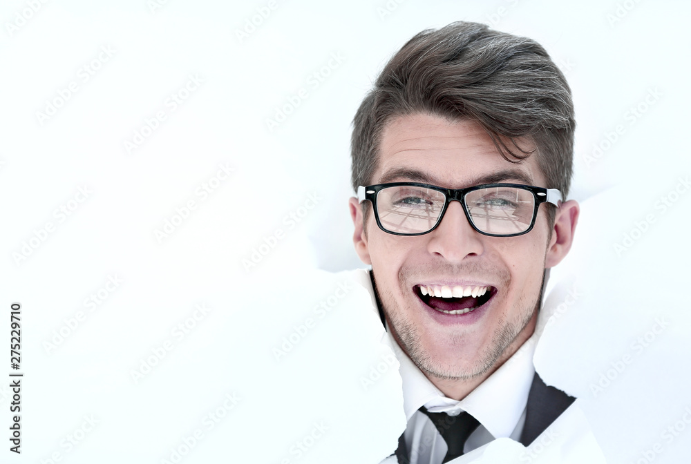 happy businessman breaks through the paper. happy businessman breaks through the paper.