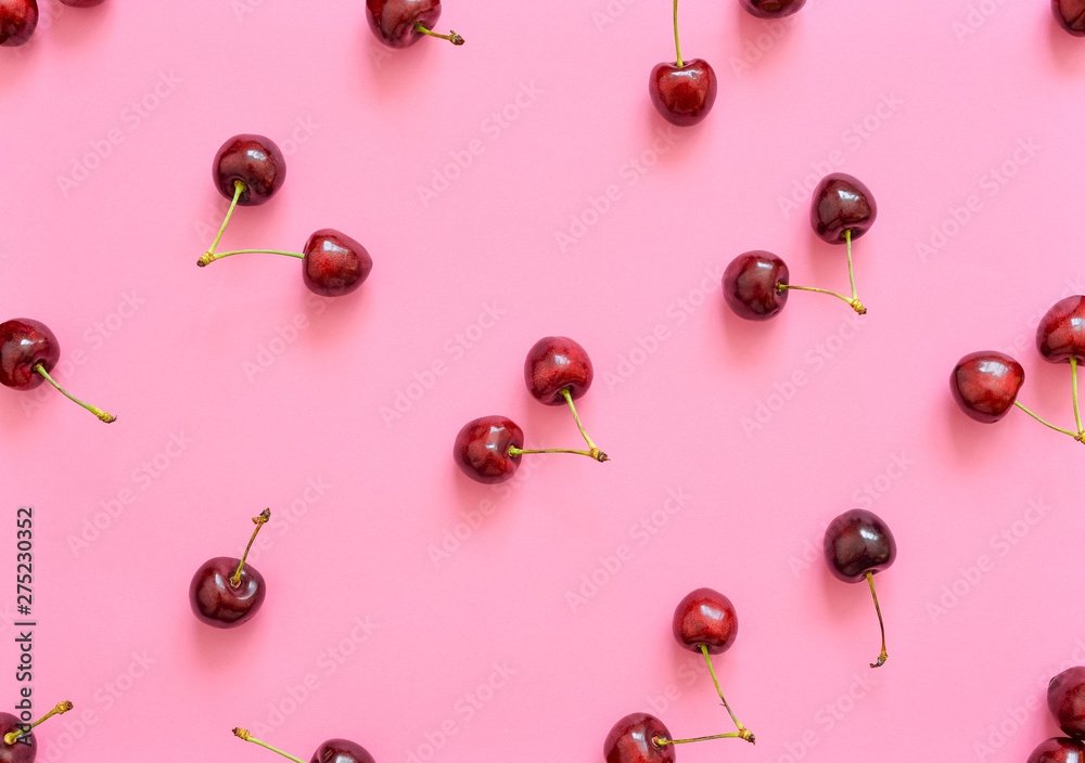 Big sweet cherry on a bright background. Cherries close up. Summer flat lay berry background. Top view cherry pattern. Big sweet cherry on a bright background. Cherries close up. Summer flat lay berry background. Top view cherry pattern.