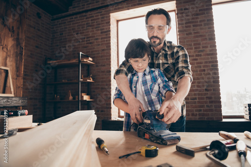 Fotografie Portrait of two nice person concentrated focused creative hard-working woodworke