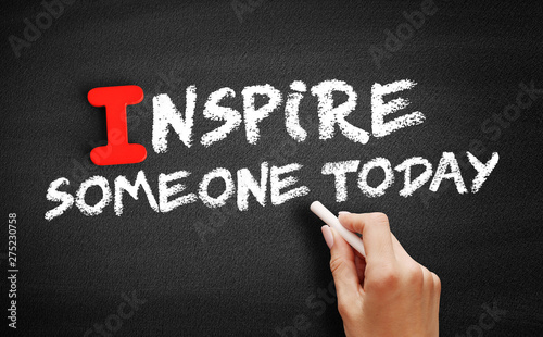 Inspire Someone Today text on blackboard, motivation concept background