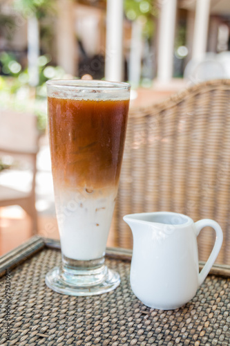 Ice coffee on a wooden table