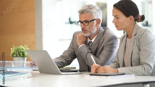 Corporate business colleagues working together in modern office