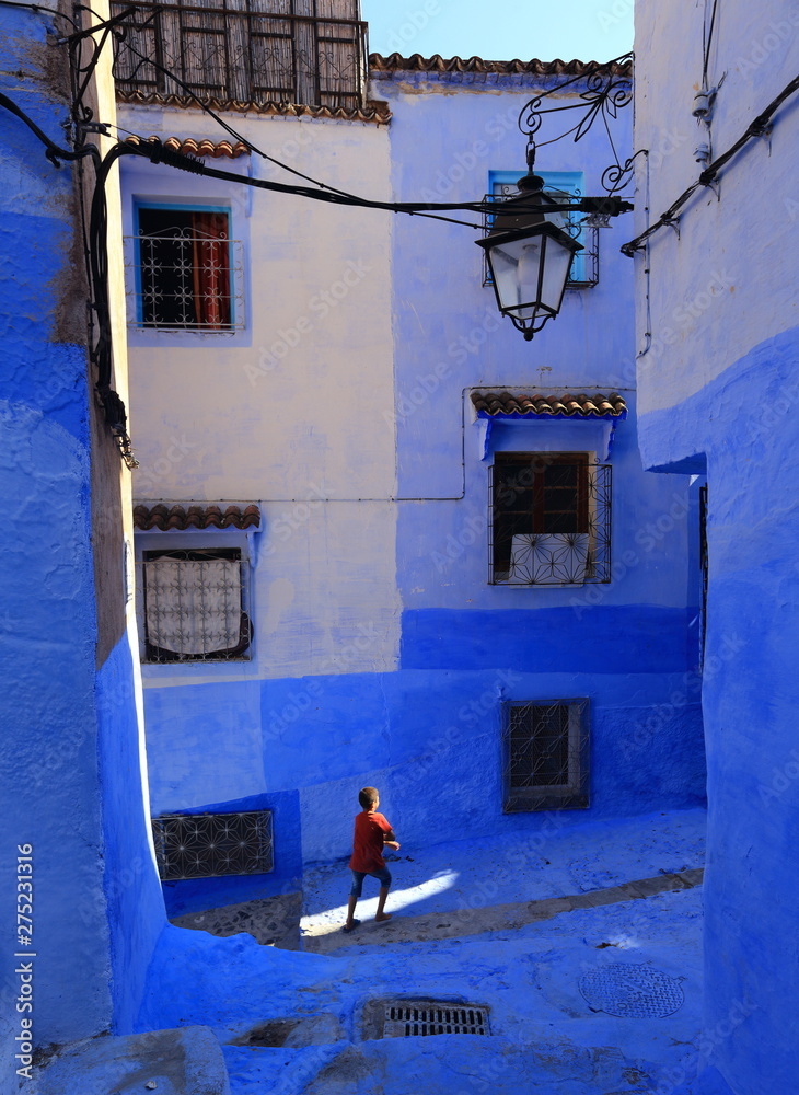 Blue street walls of the popular city of Morocco, Chefchaouen. Traditional moroccan architectural details.