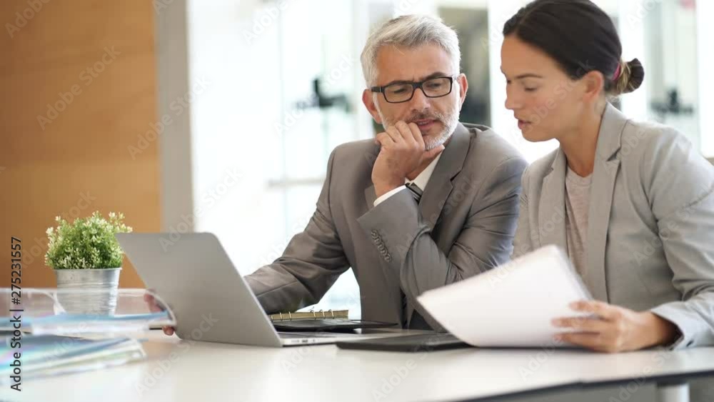 Corporate business colleagues working together in modern office