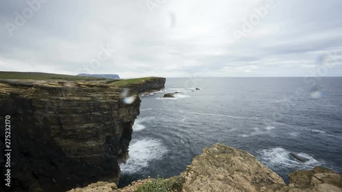 Timelapse of waves splasing at the cliffs of orkney island. photo