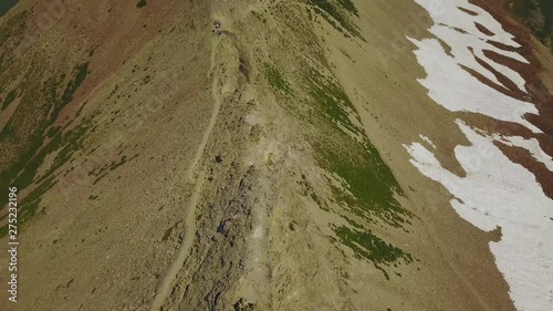 Panning Up Drone Shot Revealing the beautiful rocky mountain tops of the Wasatch Mountains in Utah. photo