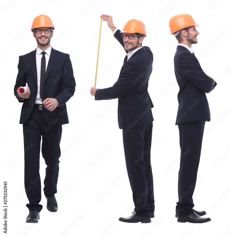 in full growth .successful architect engineer in orange helmet. in full growth .successful architect engineer in orange helmet.