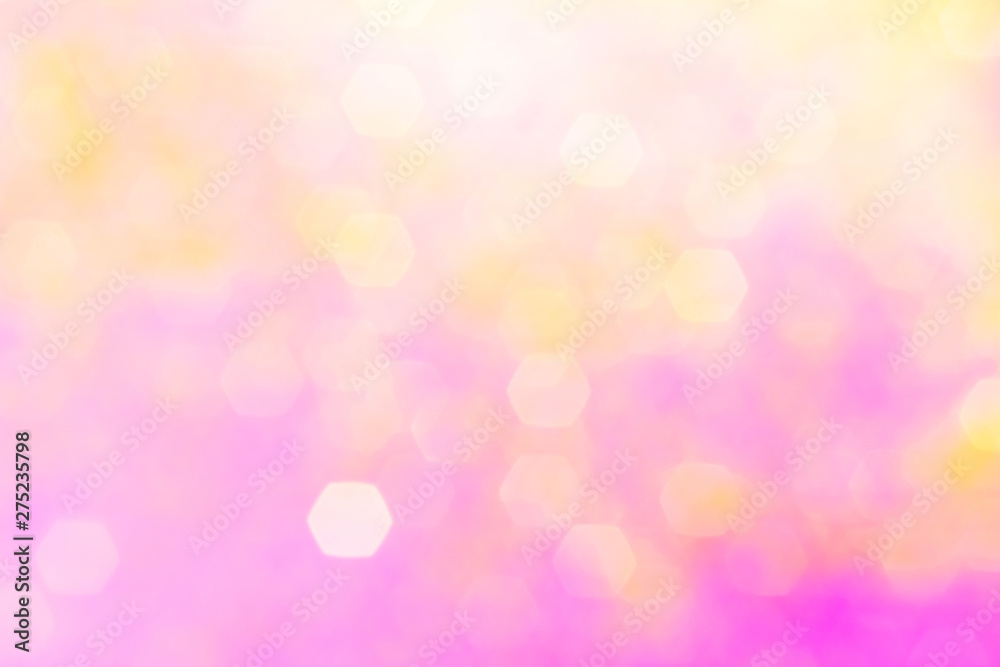 Blurred background - pink surface with gold sparkles. Abstract image. Bright color. Abstract circular bokeh.