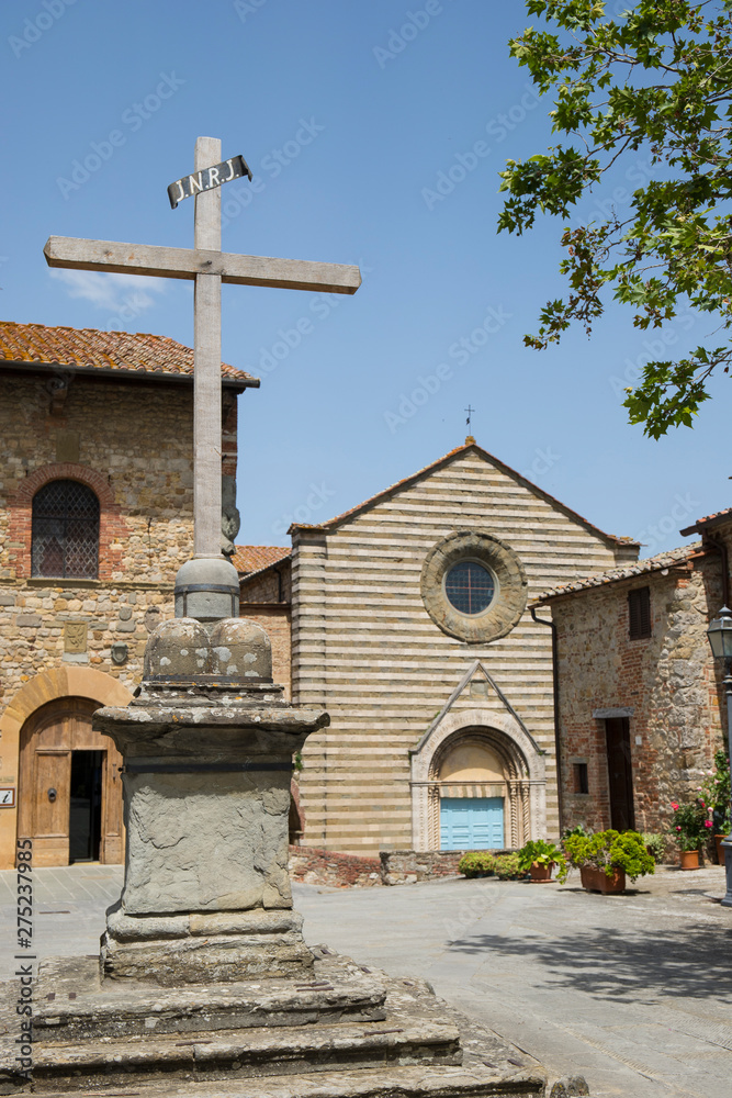 Christian cross monument in the center of the medieval village of Lucignano. Christian cross monument in the center of the medieval village of Lucignano.